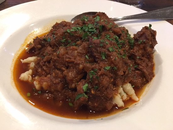 The Pantry signature dishes The Board (charcuterie and cheese), Wiener Schnitzel, Hungarian Goulash, Bacon-Wrapped Dates